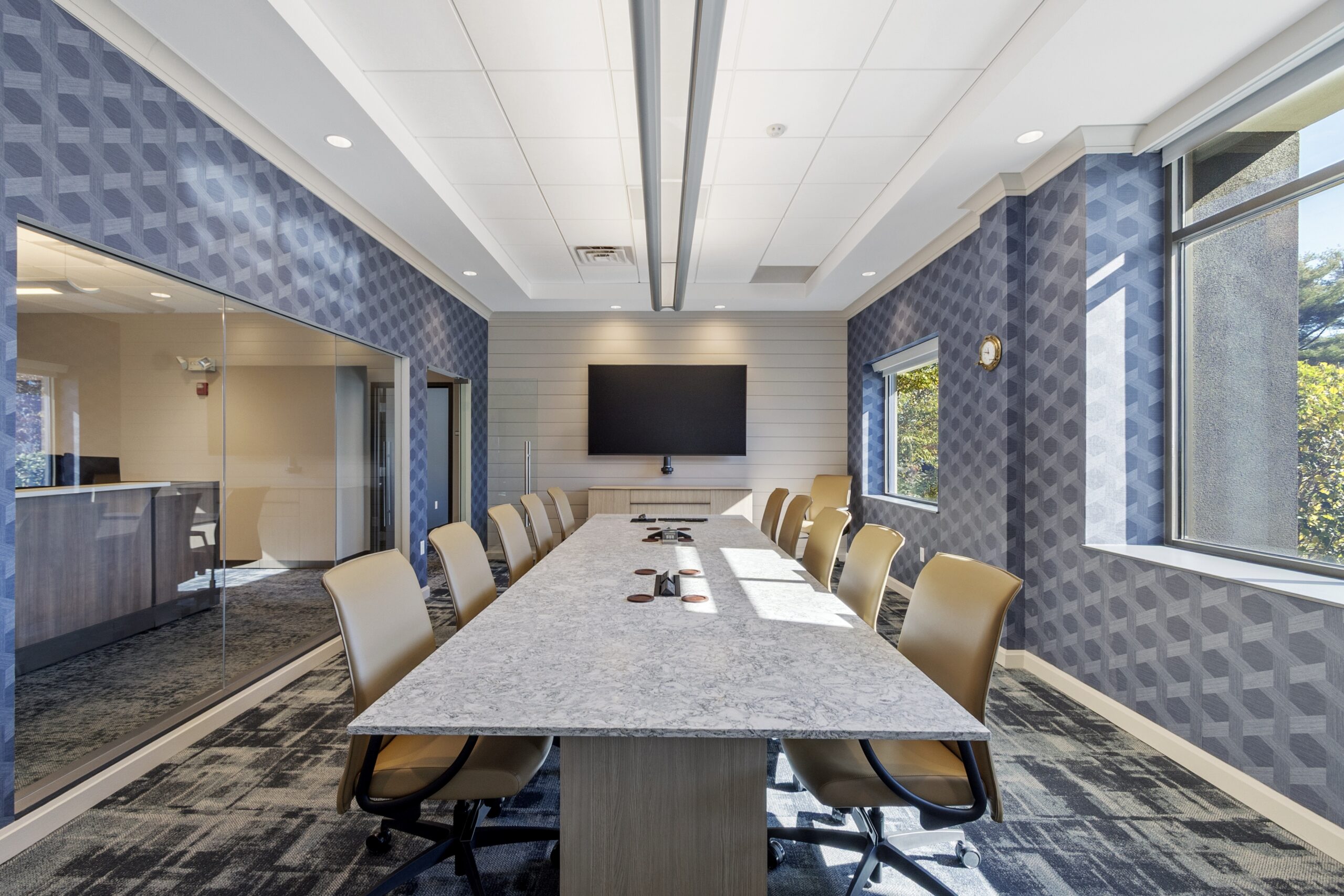 Renovated conference room with marble table and glass partition walls in Woburn, MA